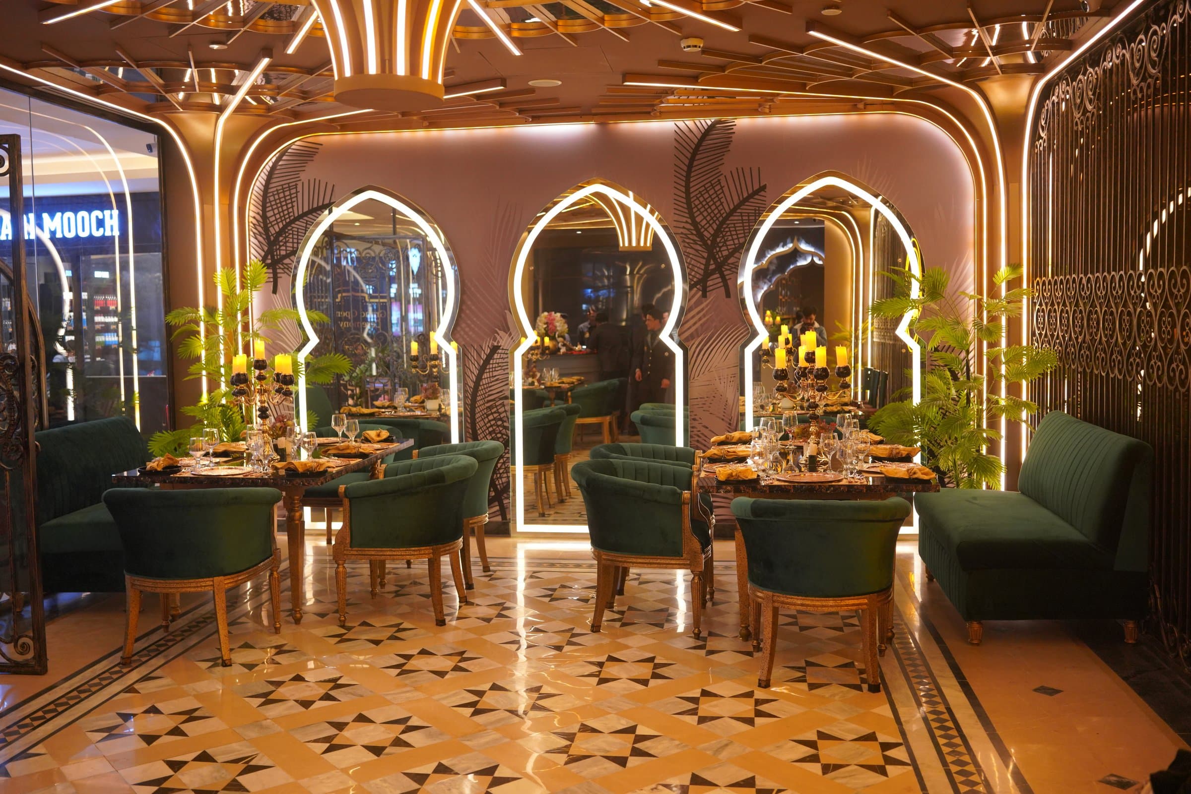 Private Mughal Booths, Curtained booths in deep mahogany and antique gold, designed for closed gatherings and quiet milestones.