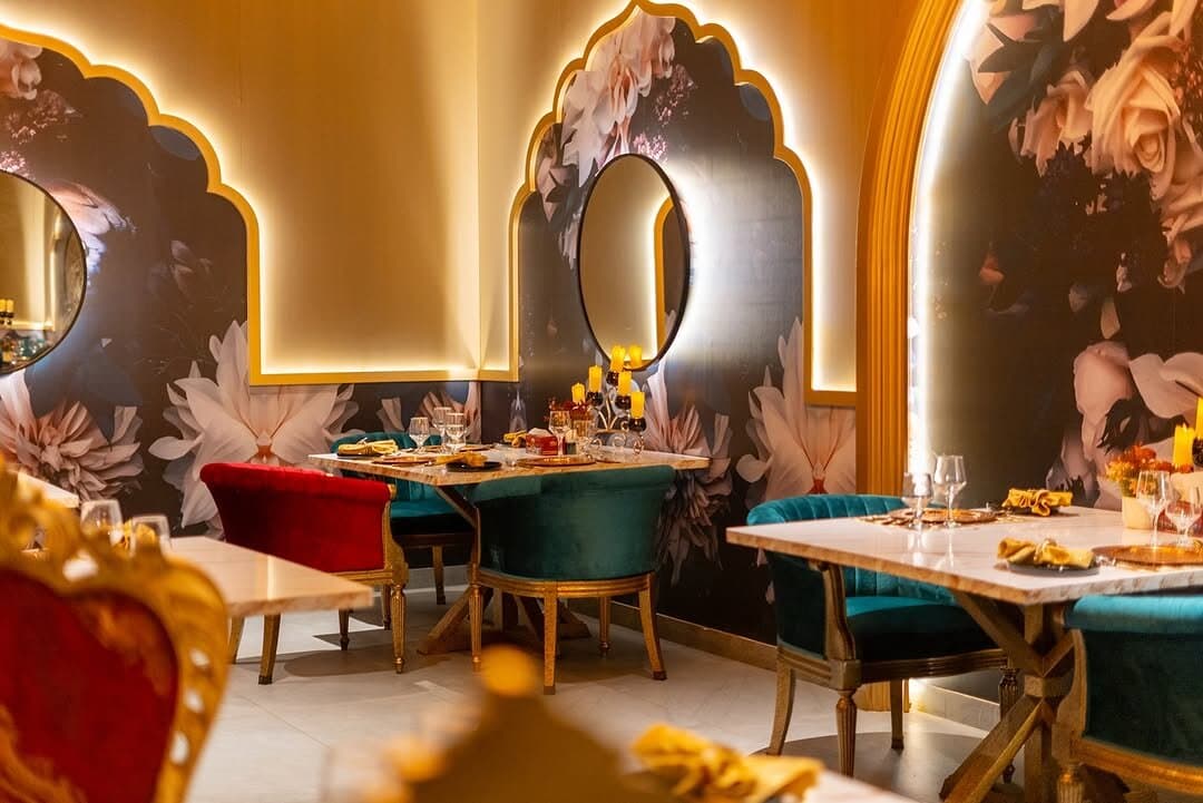 Stained Glass & Jaali, Hand-cut Mughal stained glass and jaali screens diffuse golden light, an architectural signature throughout.